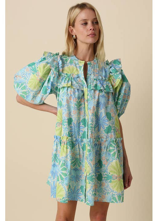 Woman wearing a floral dress on a beige background