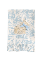 Baby blanket with embroidered bunny and bow on a blue and white floral pattern
