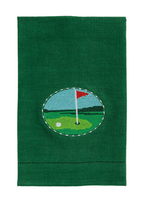 Green towel with a golf course design featuring a red flag and white ball on a white background