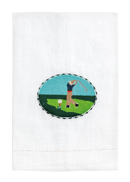 White towel with a golf-themed embroidered design on a white background