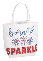 White tote bag with 'born to SPARKLE' text and fireworks design on a white background