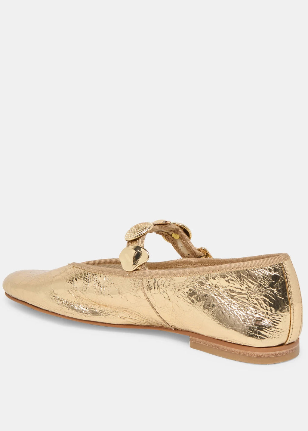 Gold metallic flat shoe with a decorative bow on a white background