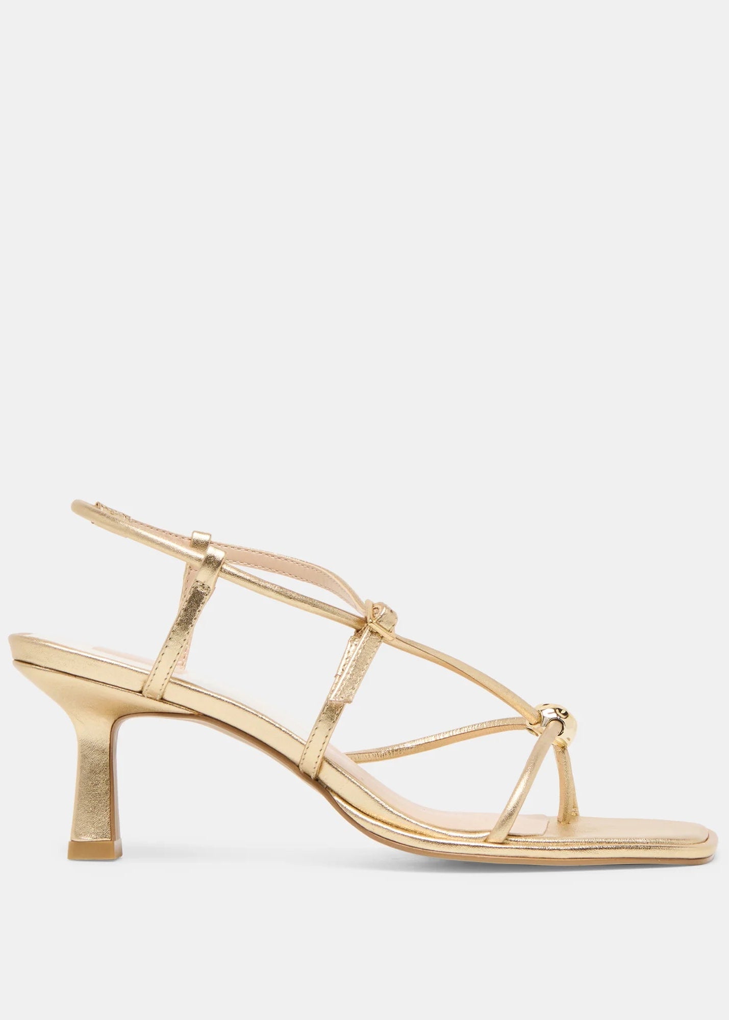 Gold high-heeled sandal on a light gray background