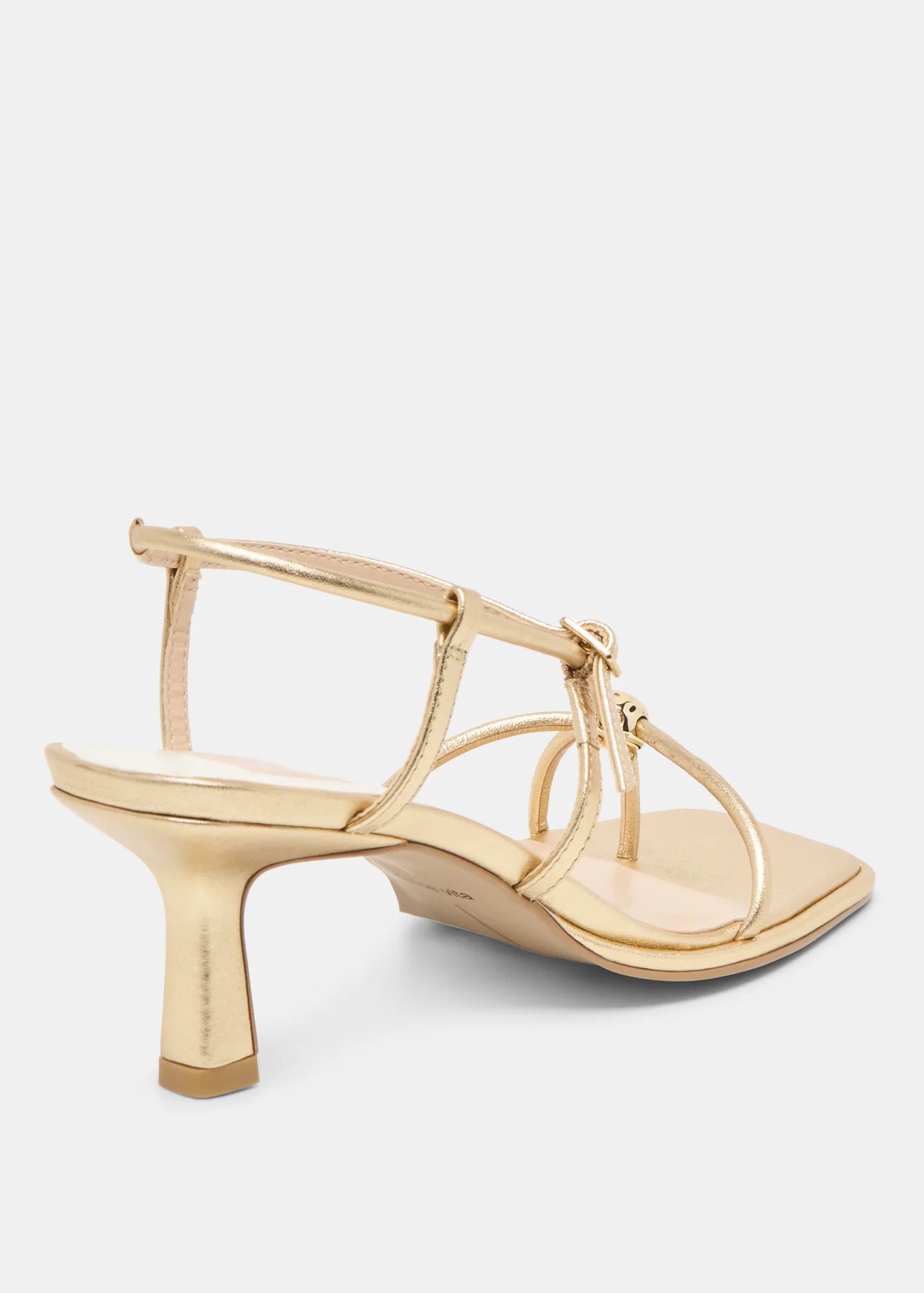 Gold high-heeled sandal on a light gray background