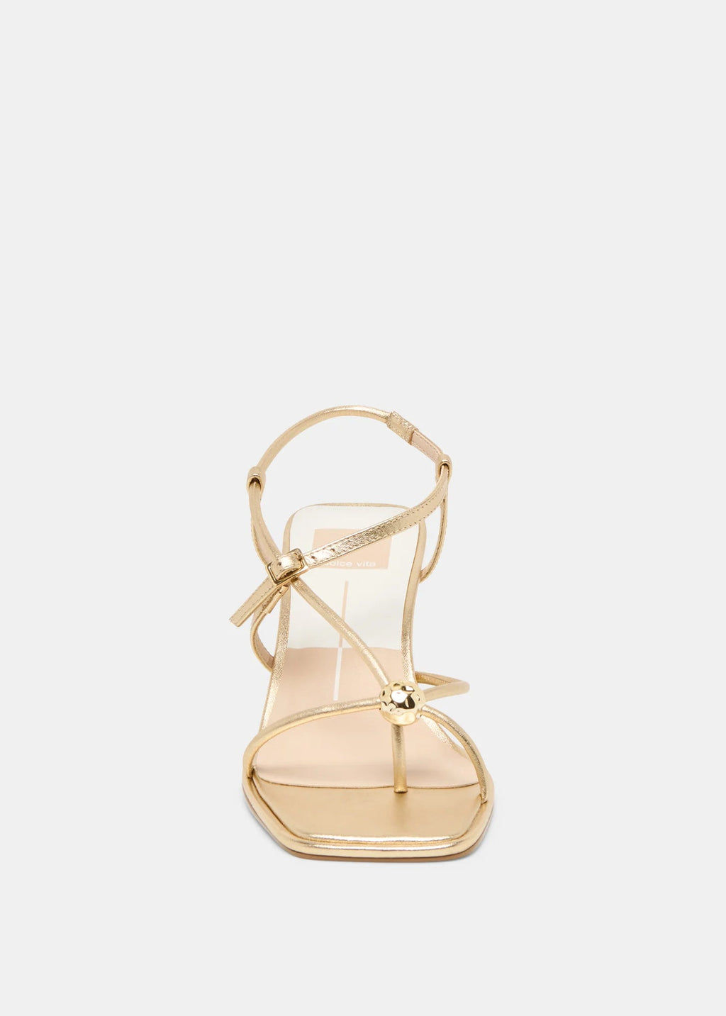 Gold high-heeled sandal on a light gray background