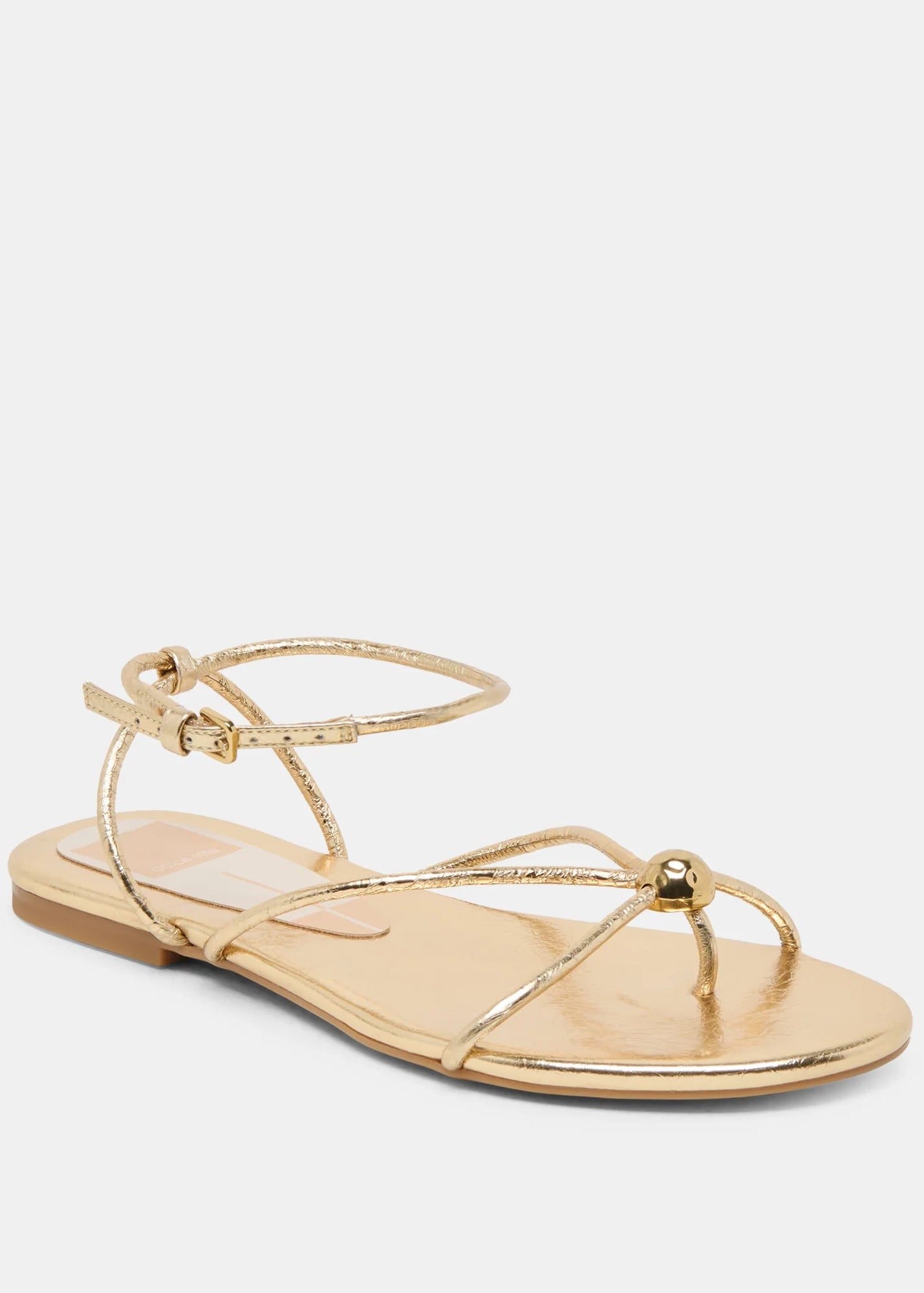 Gold sandal on a white background