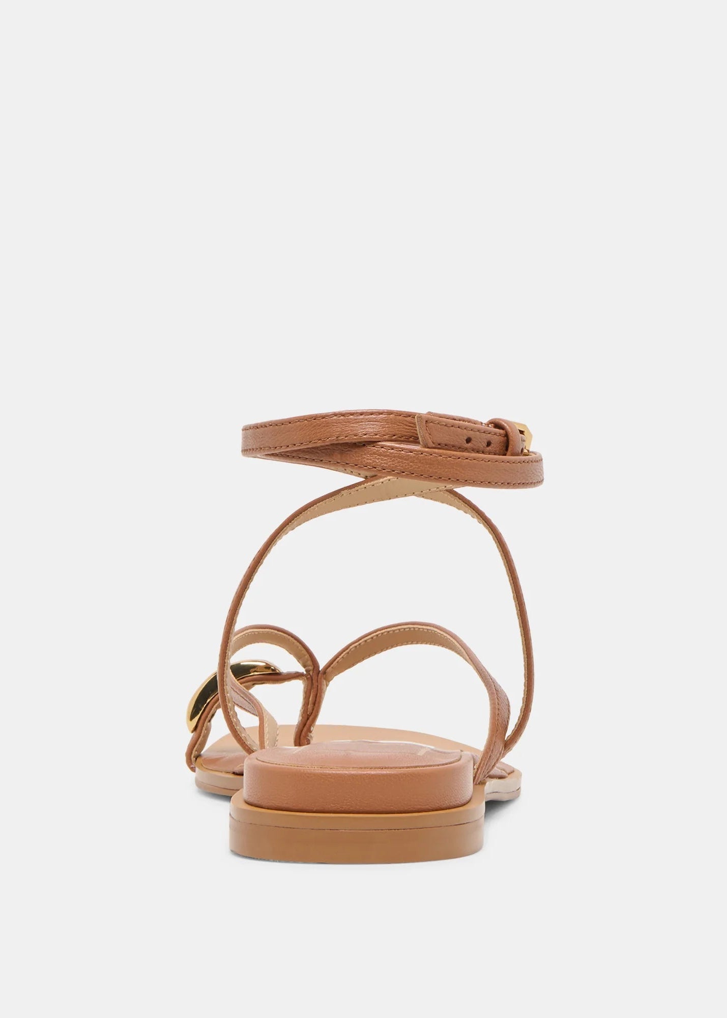 Tan sandal with multiple straps on a light gray background