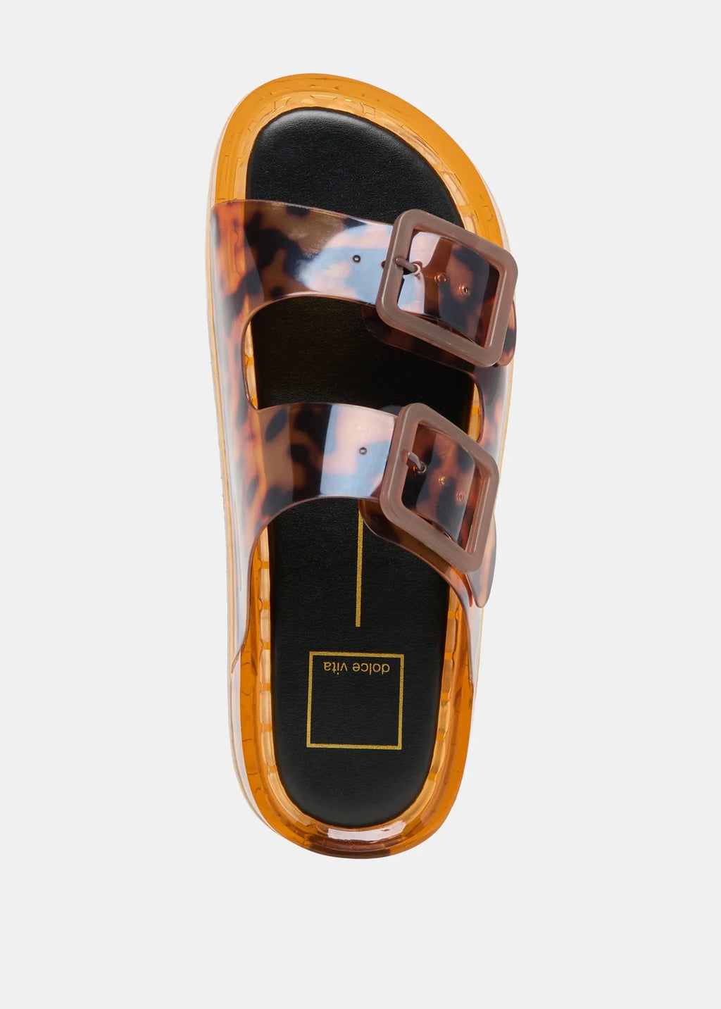 Tortoiseshell sandal with brown straps on a light gray background