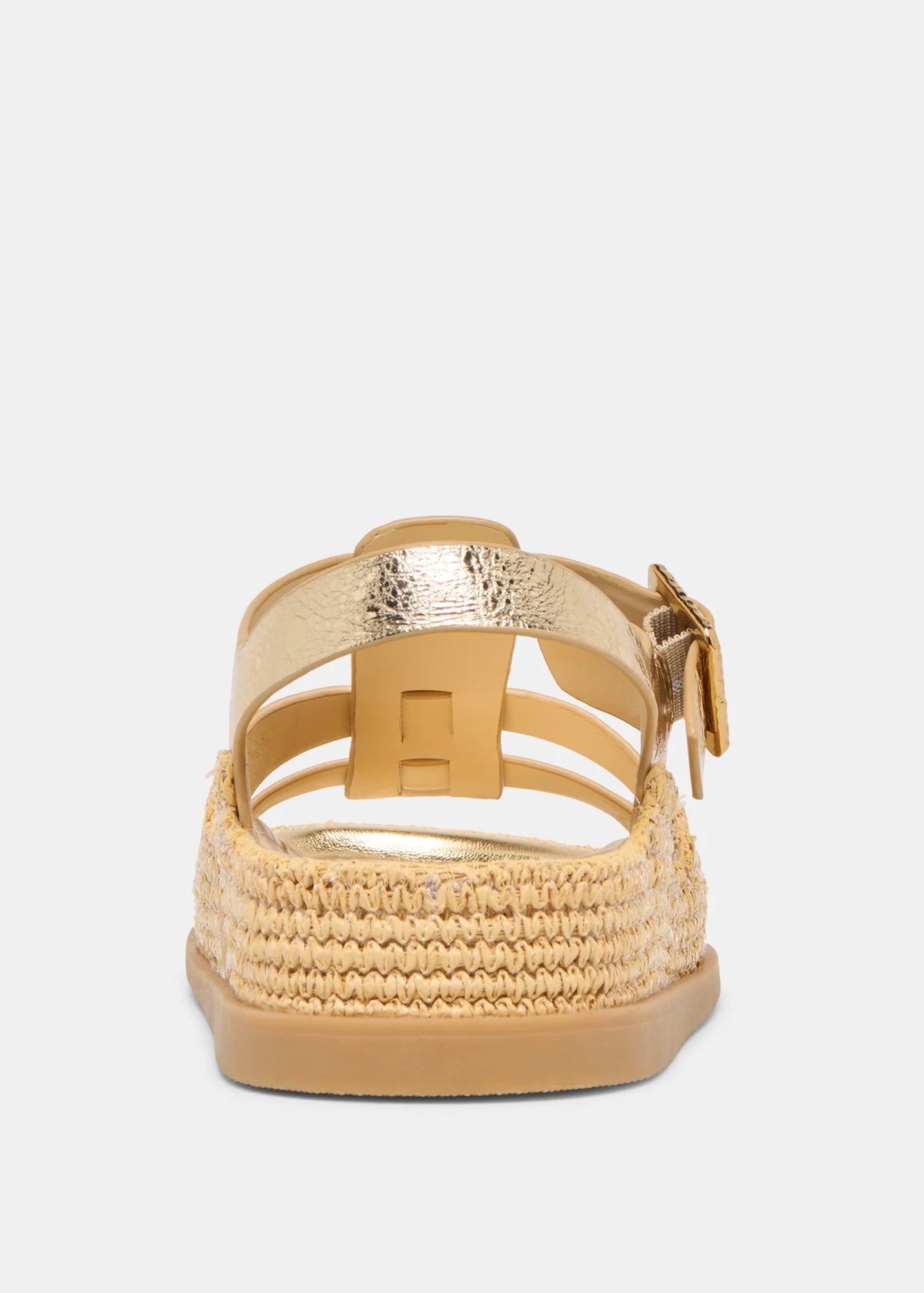 Gold sandal with raffia sole on a white background