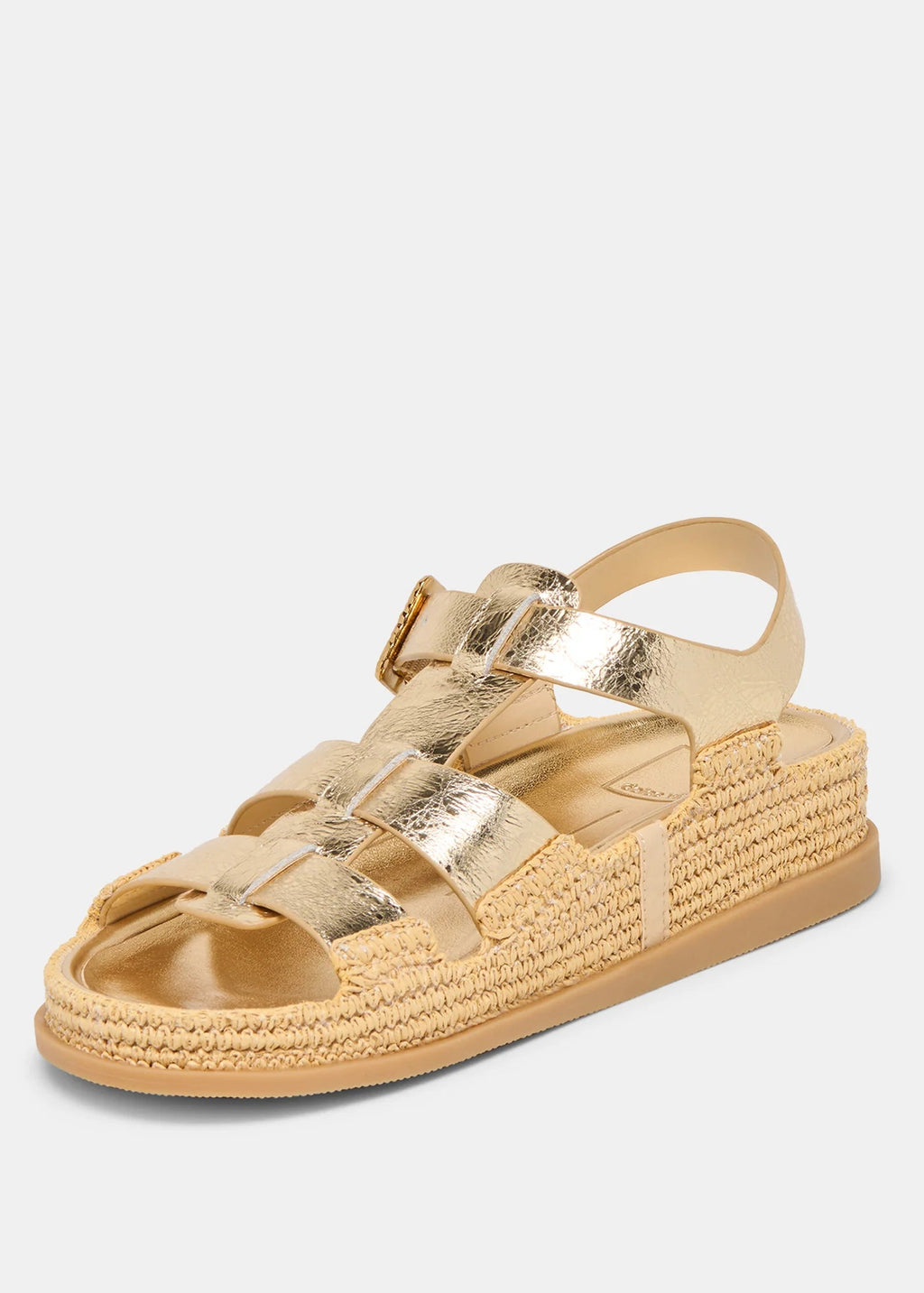 Gold sandal with woven sole on a light gray background