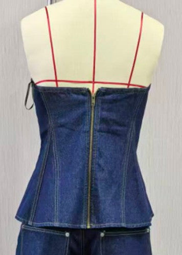 Blue denim corset on a mannequin with a grid pattern against a gray background