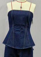 Blue denim top on a mannequin with a white background