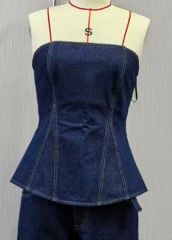 Blue denim top on a mannequin with a white background