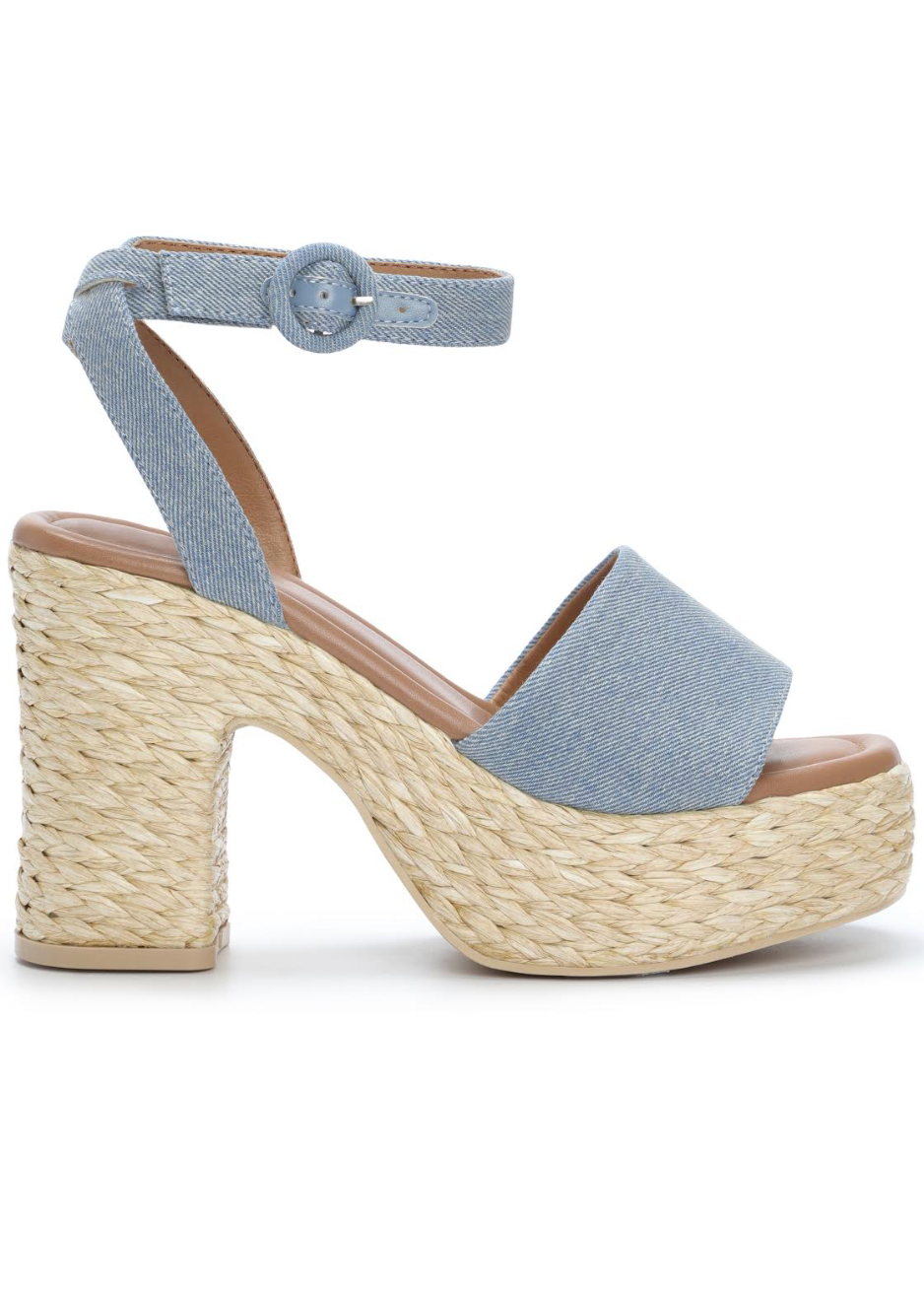 Light blue sandal with woven sole on a white background