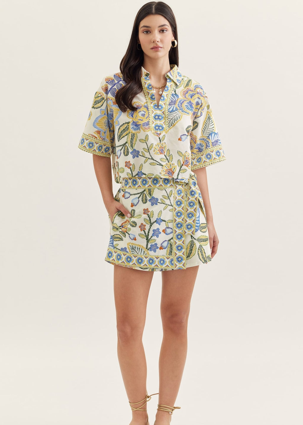 Woman wearing a floral dress on a white background
