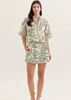 Woman wearing a floral dress on a white background