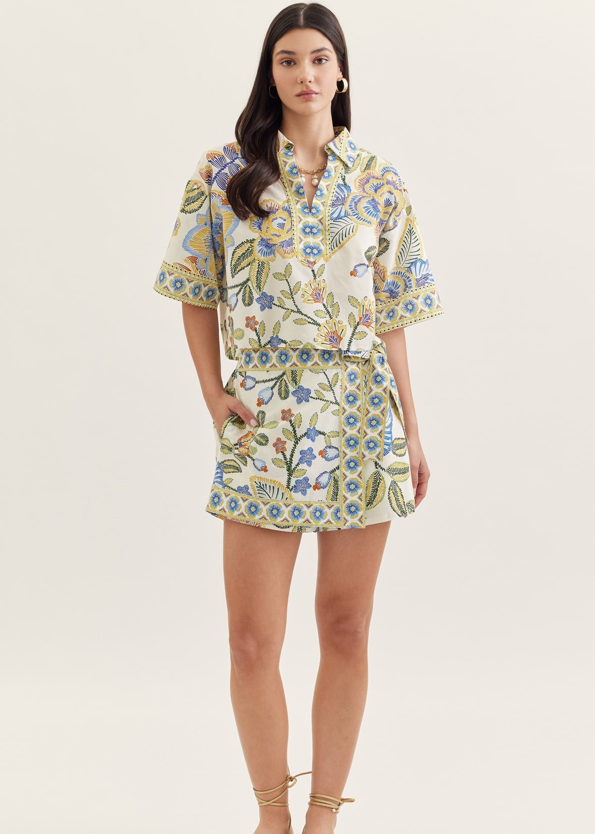Woman wearing a floral dress on a white background