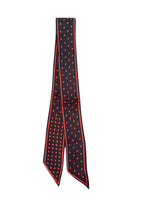 Black scarf with red polka dots on a white background