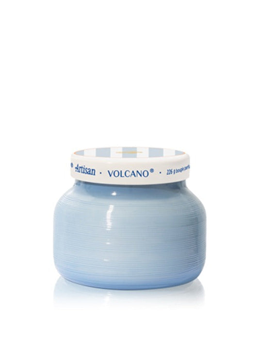 blue candle with white and blue striped lid