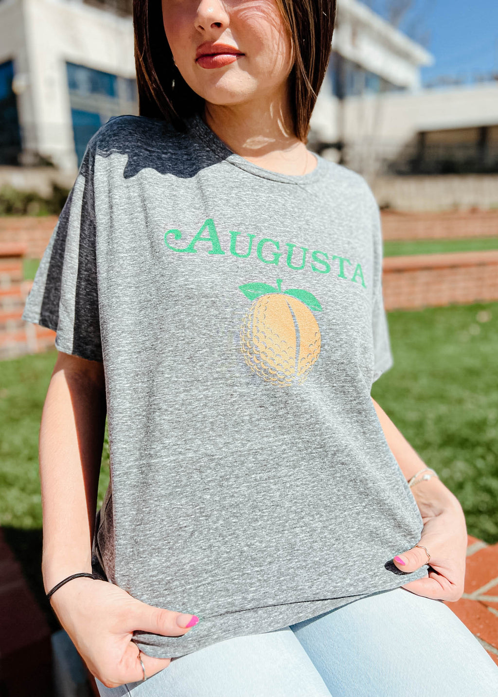 Model is wearing the Augusta, GA Golf Tee Shirt